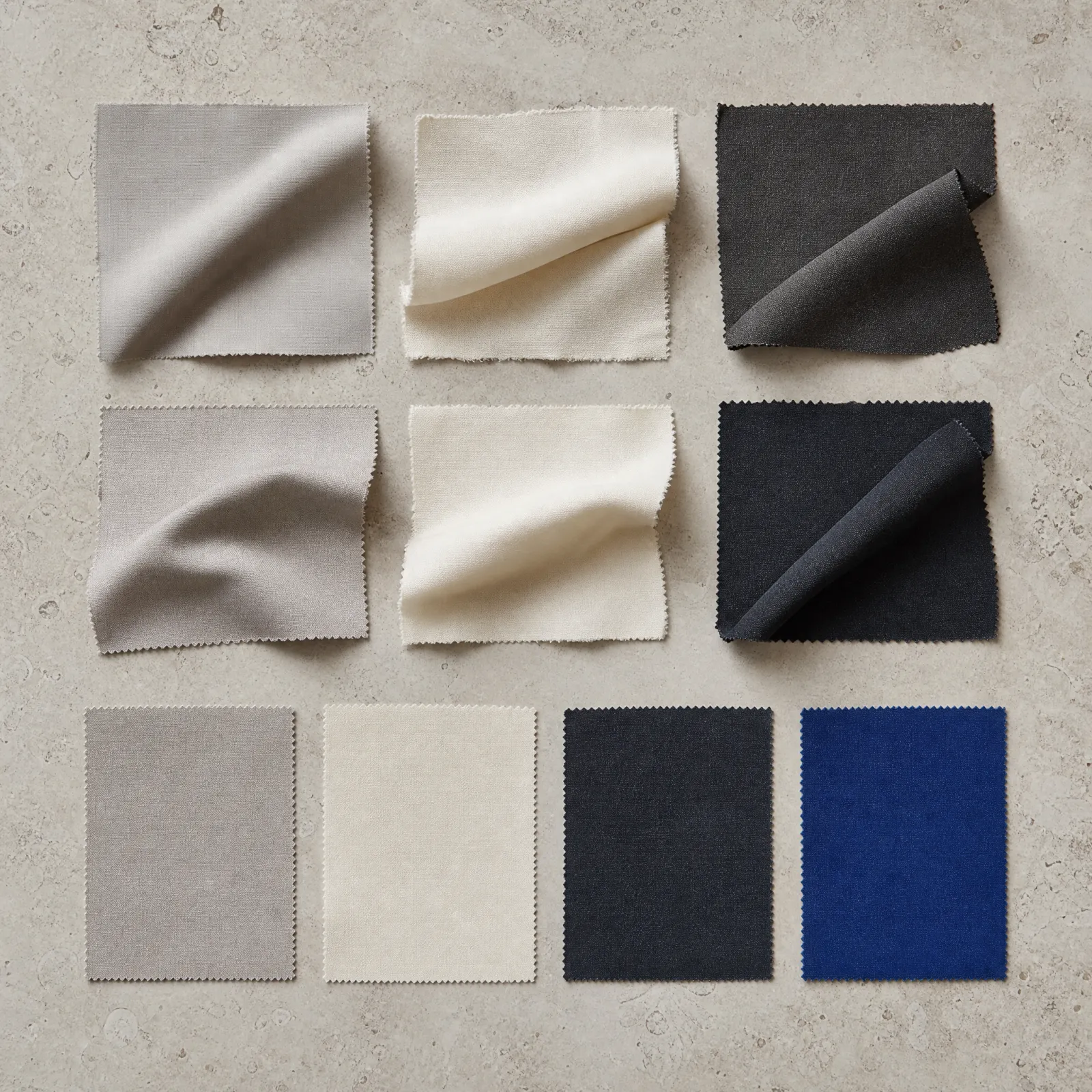 Fabric swatches in stone, ivory, charcoal, navy and cobalt