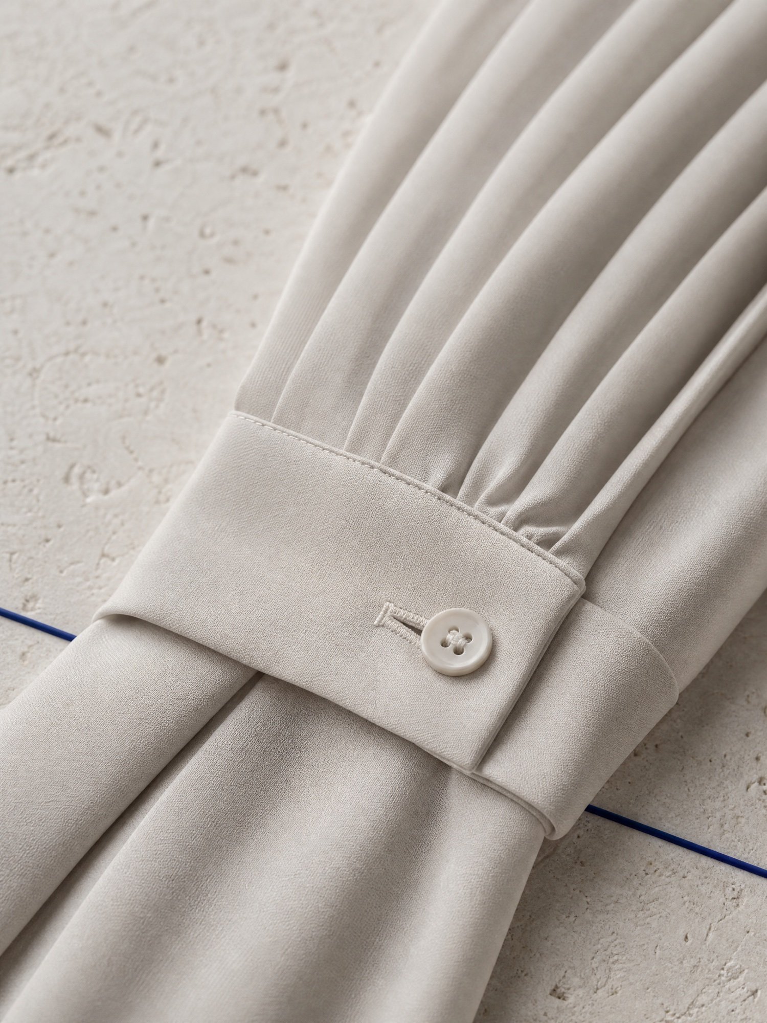 Pleated Midi Skirt in Stone, close-up detail